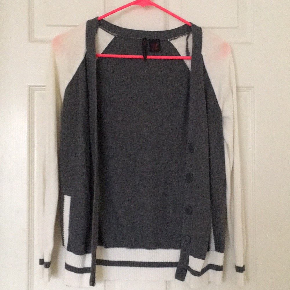 Gray and cream colored cardigan.